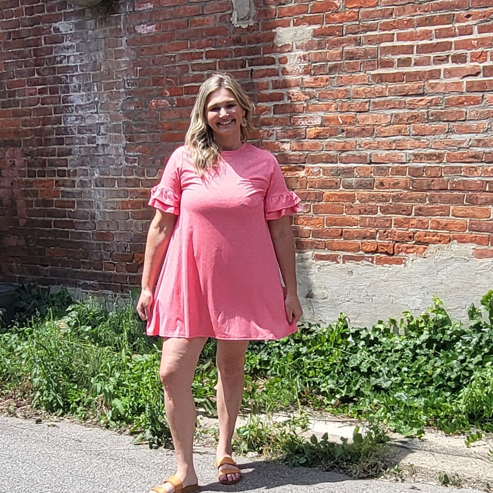 New in T-shirt Dress with front pocket and ruffle sleeves.